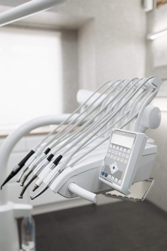 Close-up of modern dental tools in a well-lit dental office, emphasizing advanced healthcare technology.